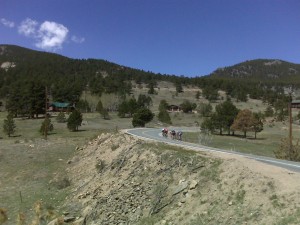 Group of cyclists heading up the road I just came down