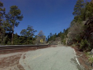 Sand and dirt washed across road in previous night's storm.